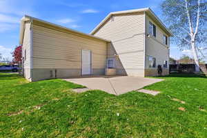 Rear view of property with a patio