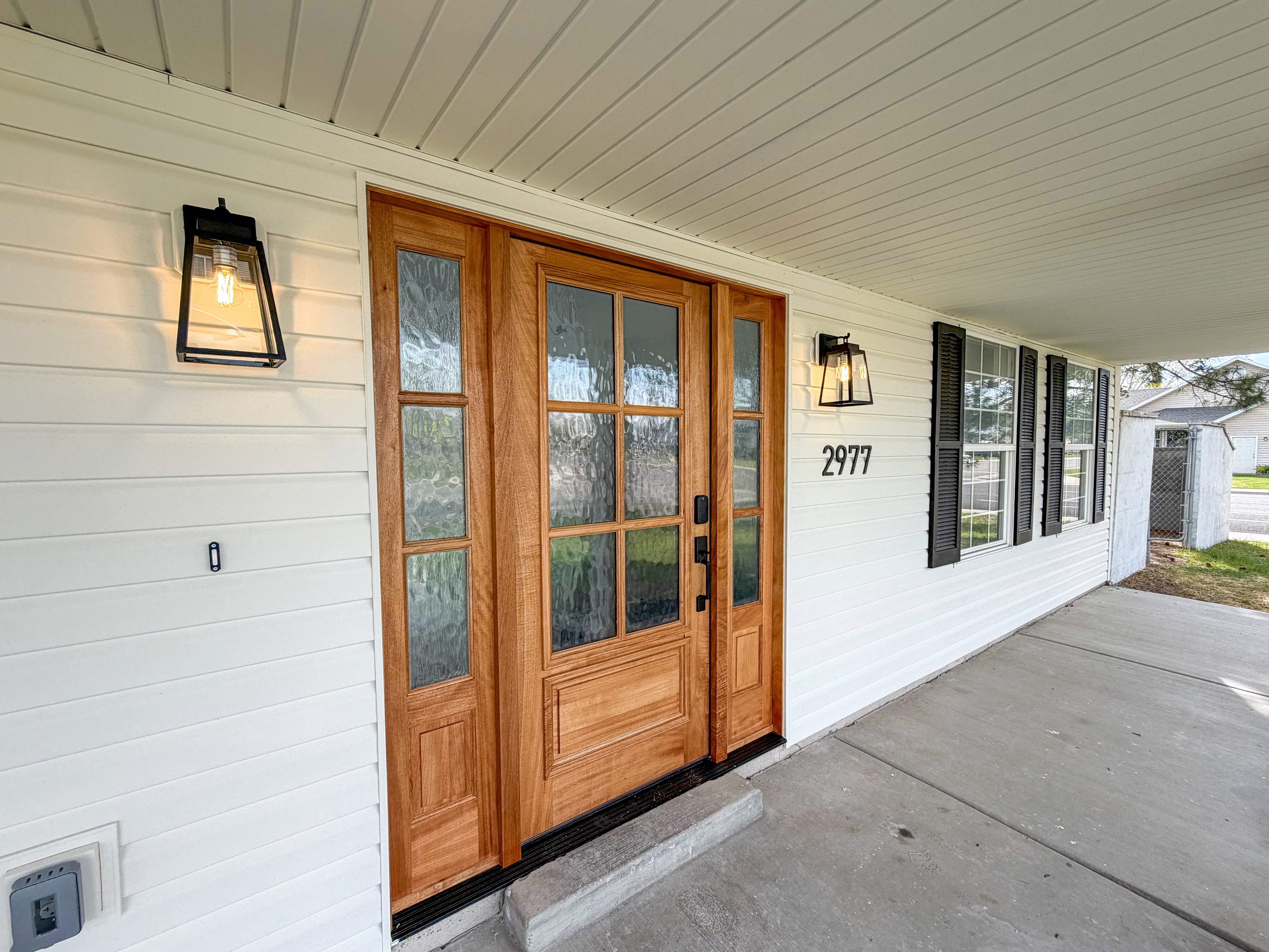 Doorway to property featuring a porch
