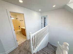 Stairway featuring carpet floors and recessed lighting