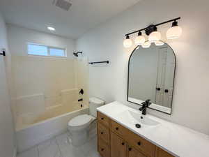 Bathroom with vanity and shower / bathtub combination
