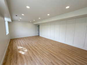 Basement featuring light wood-type flooring and recessed lighting