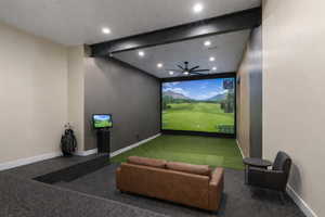 Recreation room featuring beamed ceiling, recessed lighting, and golf simulator