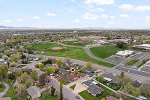 Aerial overview of property's location with a mountain backdrop and nearby suburban area