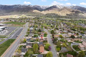 Aerial perspective of suburban area featuring a mountainous background