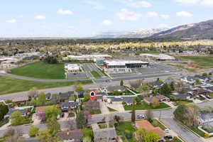 Aerial overview of property's location with nearby suburban area and mountains