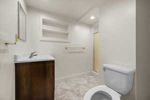 Bathroom featuring vanity, a shower stall, and recessed lighting