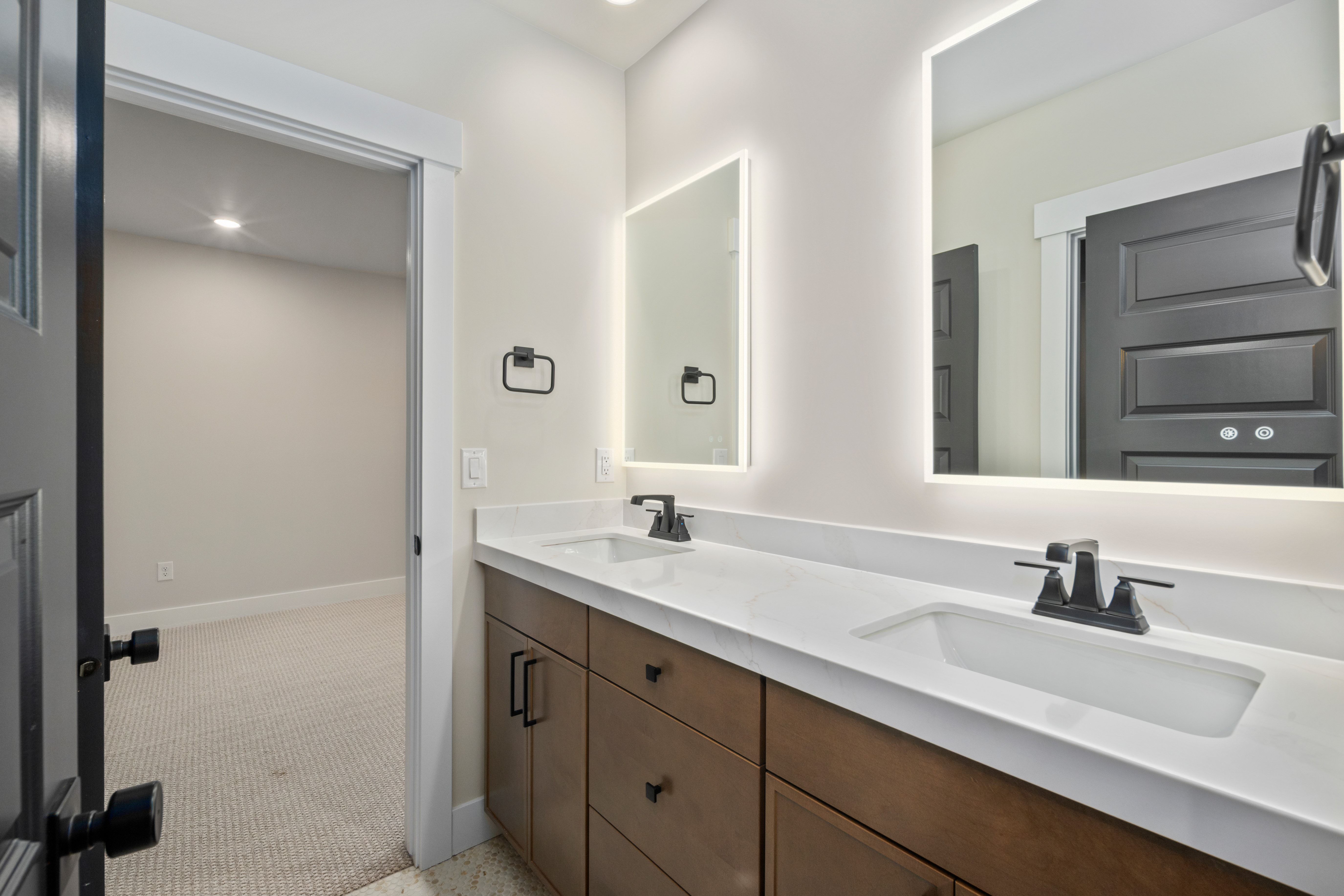 Dual vanity with integrated sinks and white countertops