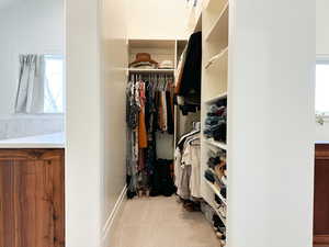 Walk in closet with carpet