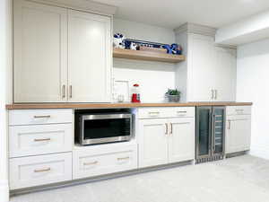 Bar with stainless steel microwave and beverage cooler