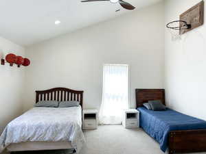 Bedroom with lofted ceiling, carpet floors, a ceiling fan, and recessed lighting
