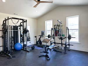 Workout area featuring a ceiling fan and recessed lighting