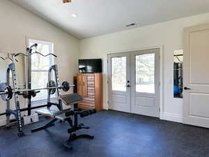 Workout room featuring french doors and natural light