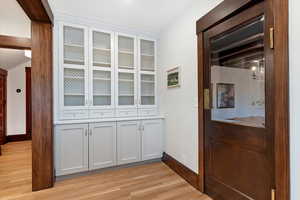 Detailed view of wood finished floors and baseboards
