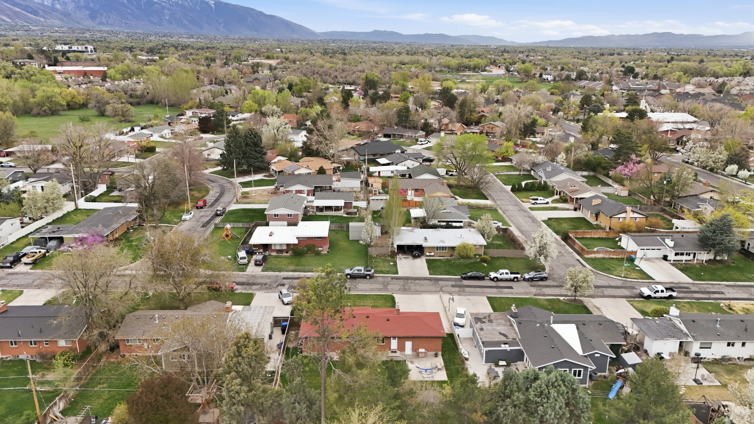Aerial perspective of suburban area with a mountain backdrop