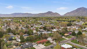 Aerial perspective of suburban area featuring a mountainous background