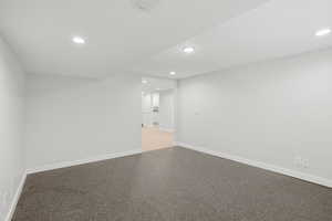 Exerecise room featuring recessed lighting and speckled floor