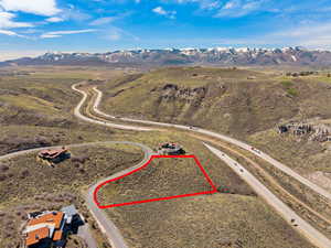 Overview of rural landscape featuring property boundaries highlighted and mountains