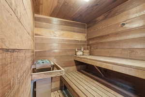 Relaxing sauna with wood walls and wooden ceiling
