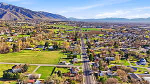 Aerial view of residential area featuring a mountain backdrop