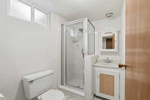 Full bathroom with a shower stall and vanity