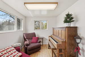 Flex living area featuring light wood-style floors and baseboards