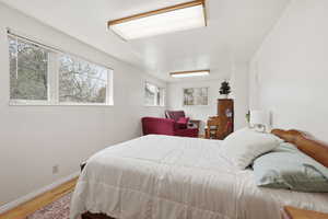 Flex living area with light wood-type flooring and baseboards