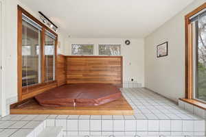 Unfurnished sunroom featuring a relaxing sauna