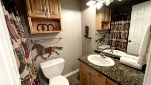 Bathroom with vanity and a shower with shower curtain