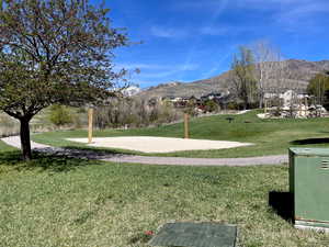 Surrounding community featuring a mountain view and volleyball court