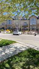 View of asphalt street with sidewalks and curbs