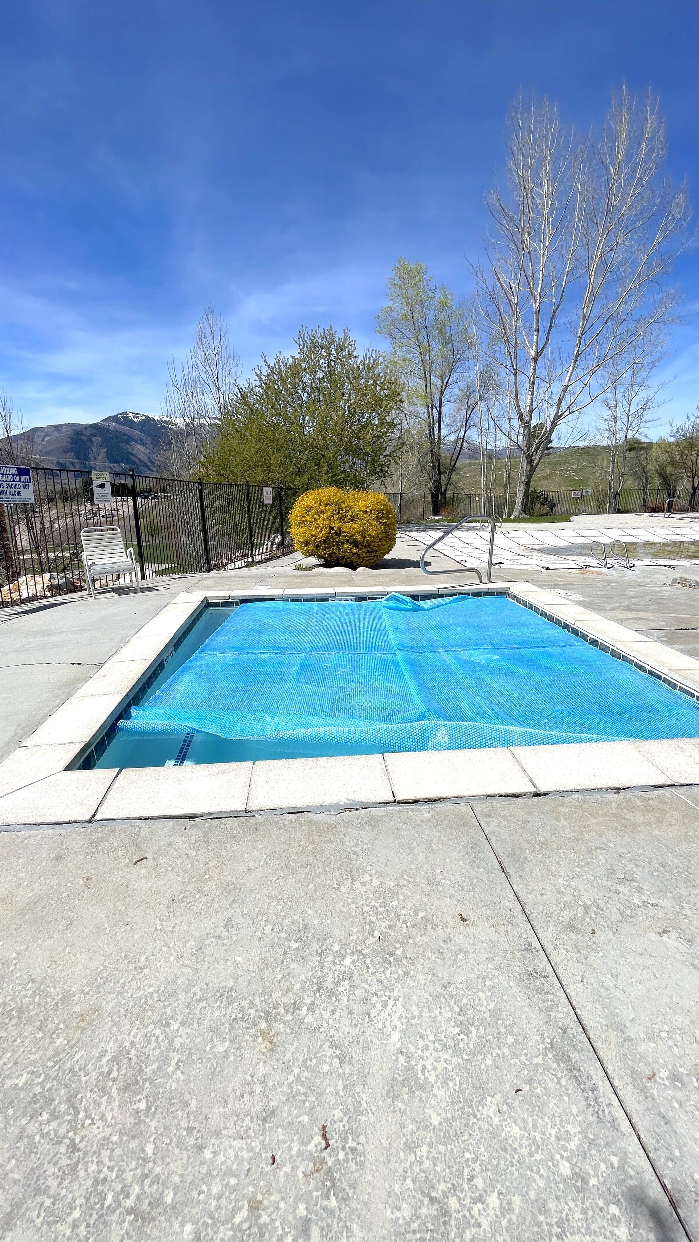 View of swimming pool featuring patio surround
