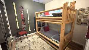 Bedroom featuring light wood-type flooring and baseboards