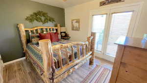 Bedroom featuring light wood-type flooring and access to outside