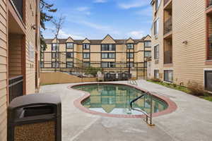 Community pool featuring a patio area