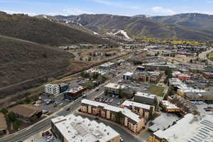 Aerial view of property's location with a mountain backdrop