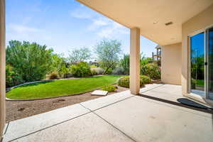 Fenced backyard featuring a patio
