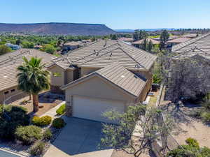 Aerial perspective of suburban area with a mountainous background
