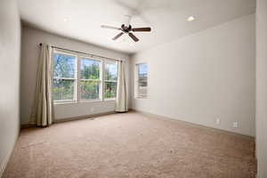 Empty room featuring light carpet, a ceiling fan, and recessed lighting