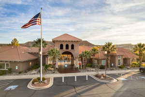 View of property with uncovered parking
