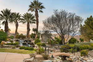 View of home's community with a water feature