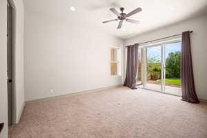 Carpeted empty room with recessed lighting and a ceiling fan