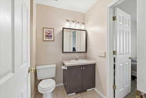 Bathroom featuring vanity and light tile patterned floors