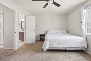 Bedroom featuring light colored carpet and ceiling fan