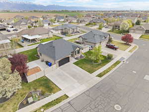 Aerial view of residential area featuring a mountain backdrop