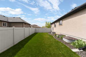 View of fenced backyard