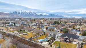 Aerial perspective of suburban area with a mountain backdrop
