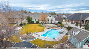 Back of house with a patio area, a fenced backyard, and a residential view