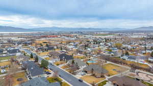 Aerial perspective of suburban area featuring a mountain backdrop