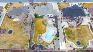 Aerial view of residential area featuring a pool