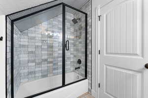 Bathroom featuring enclosed tub / shower combo